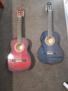 2 Guitars 🎸 red and blue, 2 years old bought brand new both have case