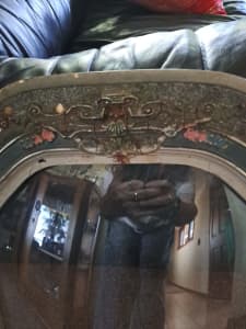 Antique/vintage frame with rounded glassass.