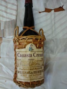Canasta Cream bottle in basket for collectors
