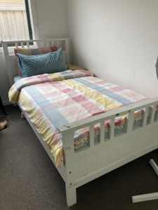 Single white bed with single mattress