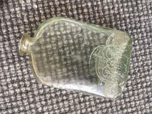 Beautiful vintage glass bottle with pattern