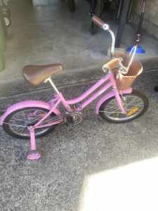 Girls bicycle with basket and training wheels
