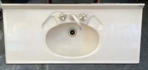 Ceramic basins with plumbing.