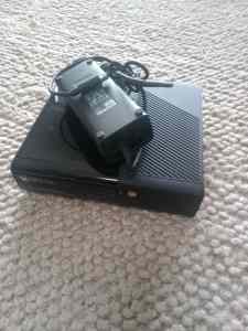 Xbox 360 console with charger, remote and HDMI cable