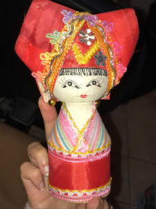 Vietnamese doll in traditional dress (wooden body but clothing isnt) 