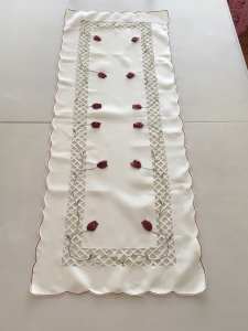 Pretty cream and rose table runner with lattice cutout design