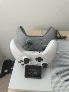 Xbox 1s with two controllers and charging stand