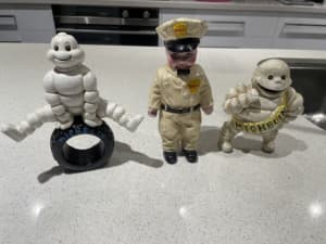 Vintage Cast Iron Shell Boy And Michelin man
