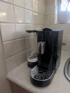 Pod coffee machine with separate milk frother