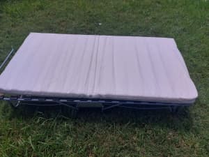 Folding single bed in as new condition