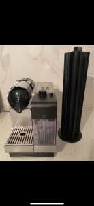 Nespresso DeLonghi coffee machine with coffee stand