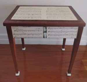 Piano stool themed in classical music sheets