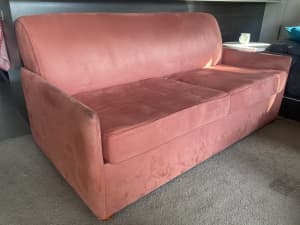 Pink two-seater sofa couch