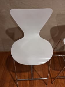 Pair of white curved bar stools