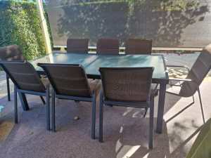 OUTDOOR SETTING - glass top table with 8 chairs