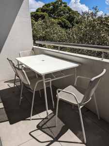 White outdoor table with 4 chairs