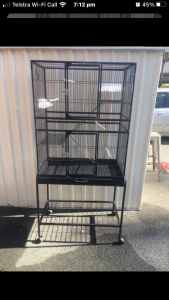BRAND NEW Cage with 3 levels Flatpk include trolley, shown in picture