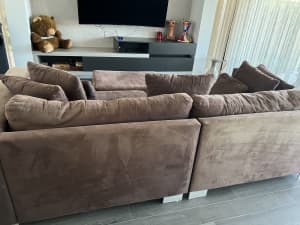 Large comfortable chocolate modular sofa with ottoman