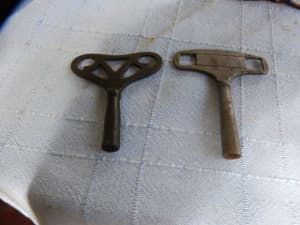 Two antique clock keys .