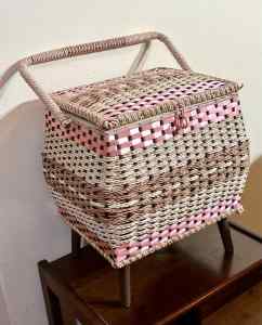 Retro 60s footed pink rattan woven sewing basket. Details below