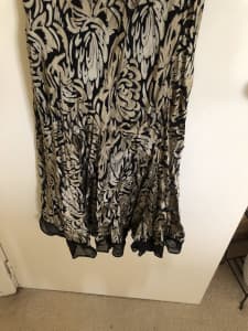 Size 16 Soft flowing gold and black calf length dress.