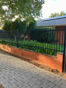 Free red bricks and black fencing