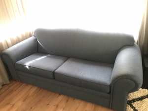 Two large blue couches.