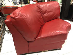 Red leather two seater couch