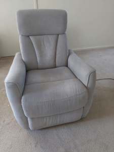 Electric recliner with adjustable headrest.