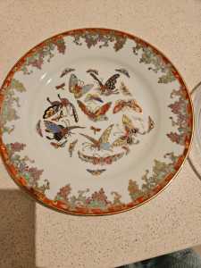 Hand painted vintage plate with butterfly design