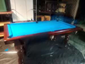 Pool table with dining top, chairs, cue holder and all accessories. 