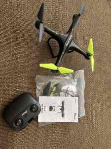 Drone used once with user manual and remote, 4 blades