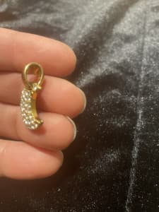 Gold plated moon shaped pendant with cubic zirconias. RRP $60