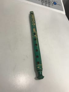 carved and painted wooden flute