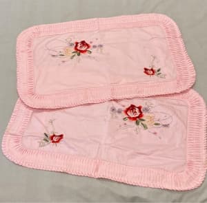 Vintage pair of pink pillow slips with rose embroidery
