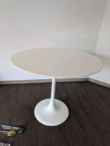 Small white circular dining table