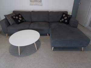 3 seater grey chaise sofa and round coffee table