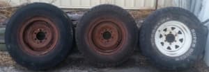 THREE LANDCRUISER WHEELS AND TYRES $25 EA OR $60 THE LOT