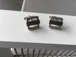 Silver coloured brushed metal cuff links with contrasting bar