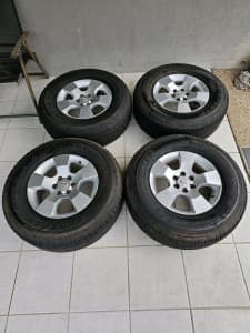 Mag wheels Nissan x 4 with tires.