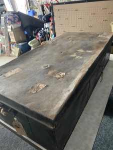 Very old metal trunk with key