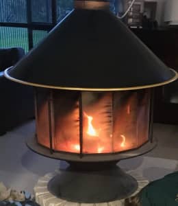 Indoor / outdoor wood heater