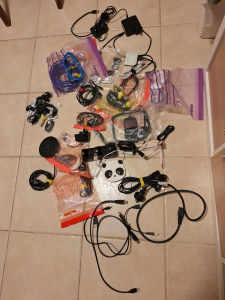 Various cables - USB, power, adapter, LAN cables, ear buds
