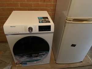 Brand new washing machine for sale and free used fridge with it