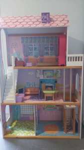Childrens dolls house with accessories