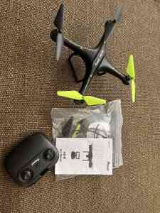 Drone used once with user manual and remote, 4 blades, video