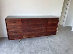 Vintage mid-century solid wood chest of 12 drawers.
