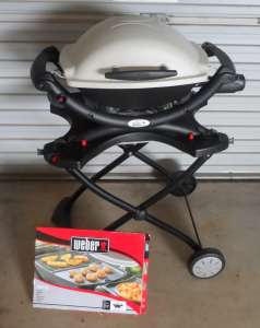 WEBER BABY Q BBQ with FOLDING TROLLEY.