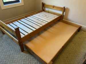 Kid’s timber single bed with trundle and mattresses included