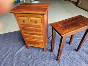 Beside chest of drawers and side table